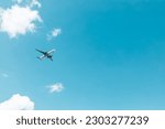 Airplane flying on blue sky