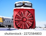Railroad Rotary Snow Plow in a Train Yard Covered in Snow