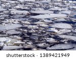 Small photo of Abstract background of drifting ice on water. Debacle