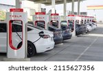 Small photo of Kettleman City, CA - Jan 29, 2022: Many cars charging at a Tesla Supercharger station. Supercharger stations allow Tesla cars to be fast-charged at the network within a hour.