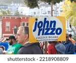 Small photo of San Francisco, CA - Oct 22, 2022: John Rizzo campaigning for College Board at Senator Scott Wiener's Halloween Pumpkin Carving Event at Noe Courts park.