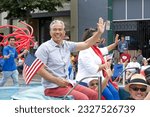 Small photo of Alameda, CA - July 4, 2023: Alameda 4th of July Parade, one of the largest and longest Independence Day parade in the nation. Rob Bonta and Mia Bonta