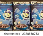 Small photo of Alameda, CA - Nov 3, 2023: Close up on boxes of Halloween theme'd General Mills brand boxes of cereal on grocery store shelf. Family Sized Boo Berry cereal.