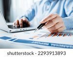 Businesswomen or investor working with financial statements and analyze company financial reports. investment, balance sheets, taxes, planning and business strategies concept.