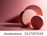 Stylish contrast dark pink abstract stage mockup with geometric composition of circle standing boxes in sunlight, shadows, copy space. Abstract scene for presentation products, advertising, design.