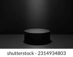 Small photo of Abstract black stage with one round podium in light beam with light spot mockup for presentation cosmetic products, goods, advertising, design in soft gradient, in modern simple style, copy space.