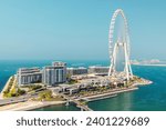 Small photo of Dubai, United Arab Emirates - June 21, 2023: Bluewaters island in Dubai with Ain Dubai Ferris wheel seen from JBR beach in Marina area. The tallest giant observation wheel ever built