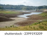 Small photo of The El-Nino natural disaster caused one of the largest dams in Bali, the Palasari Dam, to experience the worst drought in history. The dam water receded and the land became dry and fragmented