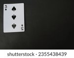 Small photo of ogan ilir,Indonesia-july 22th,2023: three of spade. rummy isolate on black background. selective Focus image