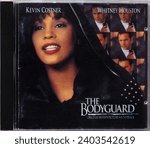 Small photo of Bavaria, Germany - December 21. 2023: Photo of The Bodyguard original motion picture soundtrack compact disk. This film stars Kevin Costner and Whitney Houston. All songs performed by Whitney Houston