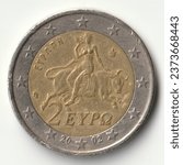 Small photo of Two euro circulating coin issued by Greece in 2002 depicting a scene from a Spartan mosaic from the 3rd century AD. depicting Europa kidnapped by Zeus in the guise of a bull.