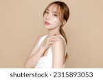 Small photo of Young Asian beauty woman model pony tail hair with korean makeup style on face and perfect skin on isolated beige background. Facial treatment, Cosmetology, Spa, Aesthetic, plastic surgery.