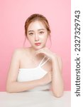 Small photo of Lovely Asian beauty woman model Pony hair with korean makeup style on face and perfect skin on isolated pink background. Facial treatment, Cosmetology, plastic surgery.