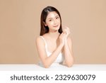 Small photo of Young Asian beauty woman model long hair with korean makeup style on face and perfect skin on isolated beige background. Facial treatment, Cosmetology, Spa, Aesthetic, plastic surgery.