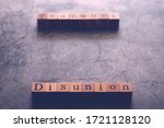 Small photo of Wood cube letter word of Disunion and Teamwork. Idea of motivation or inspiration in business vision and corporate management strategy. Leadership lead team to reach goal or achievement.