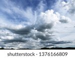 Small photo of Gathering clouds on blue sky