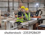 Small photo of Two dedicated engineers, a woman and a man are engaged in a thorough review of the control panel data in a factory. serious demeanor reflects their commitment to precision and quality in work