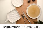 Small photo of Minimal dining table setting mockup with different size of empty plates, silverware and decor over placemat. flat lay, empty plate mockup.