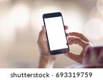 Man's hand using cellphone outdoor, Man typing text message on smart phone, Blurred background