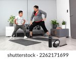 Small photo of Latino mom and son exercise at home to lose weight and be healthy to avoid diseases such as diabetes or hypertension