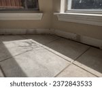 Small photo of Preparing baseboards after removing old baseboards; installing baseboards after flooring