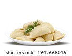 Boiled dumplings on a white plate close-up. Russian cuisine. Isolated image.