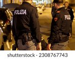 Small photo of Italian police officers investigating a nighttime murder scene. Italian police at night. Taranto, Apulia, Italy. 26.05.2023