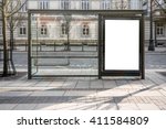 Blank white mockup of bus stop vertical billboard in front of empty street background
