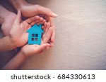hands holding paper house, family home, homeless shelter and real estate, housing and mortgage crisis, foster home care, family day care, social distancing