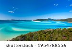Hill Inlet at Whitsunday Island - swirling white sands, sail boats and blue green water make spectacular patterns on a beautiful clear blue sky day