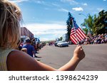 Girl holding usa flag at 4th of ...