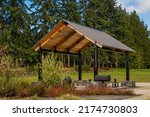 A PICNIC SHELTER WITH BARBECUE AND GRASS PLAY AREA IN THE CITY OF BELLEVUE