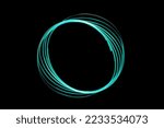 PHOTOGRAPH OF A TEAL COLORED ROUND NEON SWIRL WITH WHITE TINTS AND A BLACK BACKGROUND
