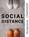 Small photo of Social distance concept. Vertical photo of two person stay away each other keeping distance, to protecting from coronavirus covid-19 spread