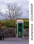 Small photo of Old Irish phone booth, public payphone in ireland with Gaelic lettering "Telefon" meaning Telephone