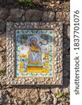 Small photo of Montserrat, Spain - Feb 23, 2020: Tile painting of mare de deu de la liet in morning sunshine