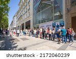 Small photo of Paris, France - June 27, 2022: People queuing outside Stranger Things Pop-Up store on avenue Champs Elysees