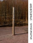 Wooden Pole With Metal Rings...