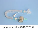 Closed tube suction isolated in a light blue background 