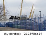 Small photo of The Millennium Dome and o2 Arena damaged by the high winds on storm Eunice. Close up view of the damage. London - 19th February 2022
