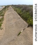 Small photo of Spurn Point, East Yorkshire, England, Britain, June 2019, disused and collapsed due to 2013 storm old road running length of Spurn Point