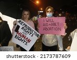 Small photo of Brisbane, Queensland, Australia - July 1 2022: Two people holding signs saying "Reproductive rights are human rights" and "I will aid and abet abortion" at abortion rights rally after overturning Roe
