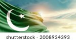 Pakistan national flag waving in beautiful sky.