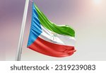 Small photo of Waving flag of Equatorial Guinea in beautiful sky. Equatorial Guinea flag for independence day.