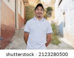Small photo of Latin man smiling outside his house in rural area - Hispanic man proud of his roots