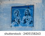 Small photo of blue wall with image of mary and jesus, religious image, catholic saints, religiosity, religious decoration, cross, crucifix
