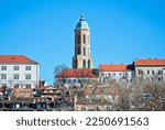 Small photo of A view of the Mary Magdalene Tower ( The Church of Mary Magdalene ) from Hungarian Jacobin Square. The church surrounded by old buildings, and the Museum of military history Budapest. Castle District.
