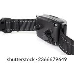 Small photo of Dog bark collar with peep and vibrating modus. Backside. Smart training collar for dogs all sizes. Device used to reduce or stop excessive barking. Selective focus. Isolated on white.