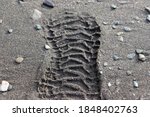 Boot Footprint On Wet Sand