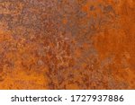 Small photo of Orange textured old rusty metal surface. An weathered oxidized patina with a copper color, texture and structure. Vintage material effect